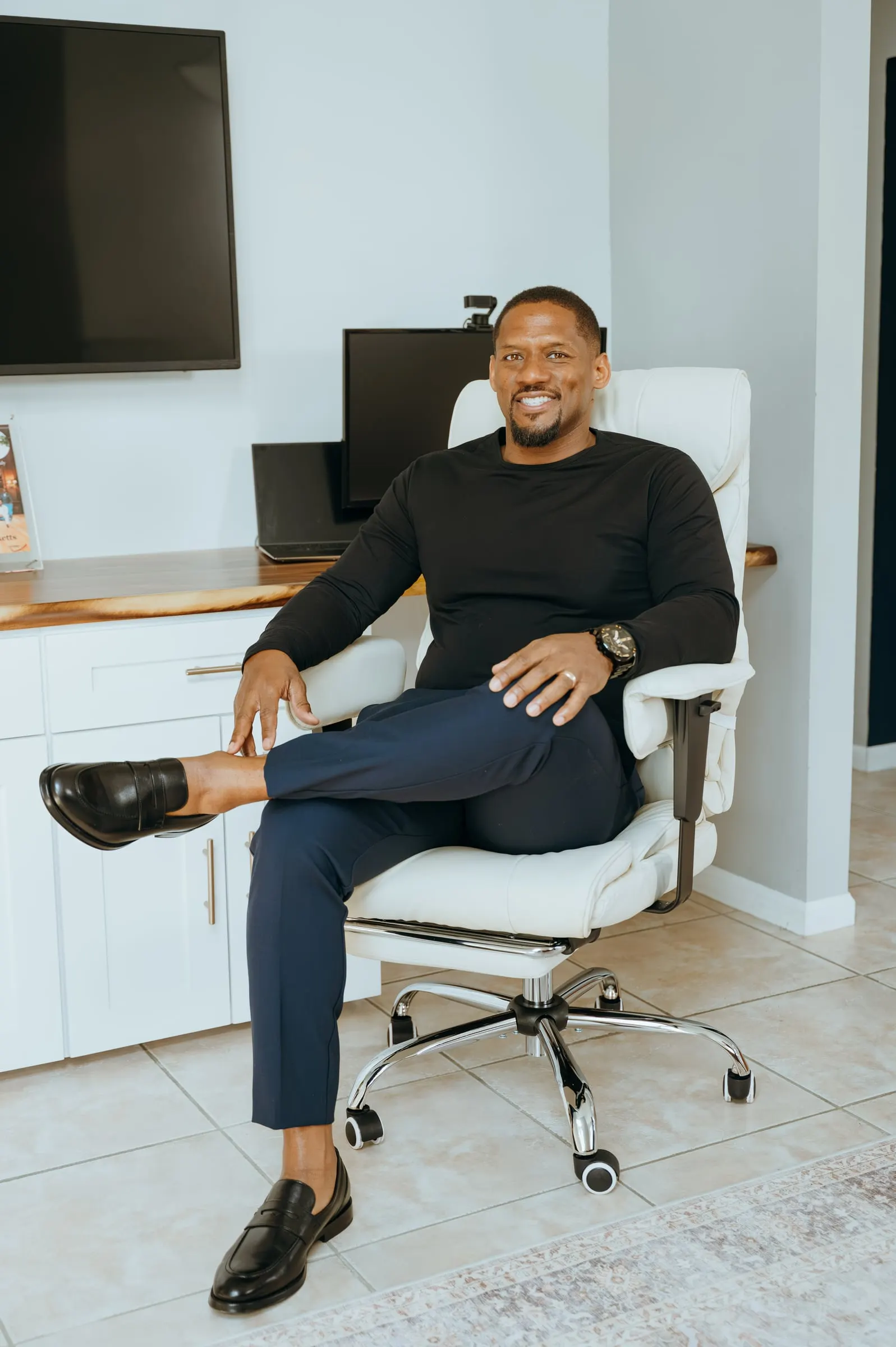 Dominique Ricketts at his desk in the KWM Consulting office